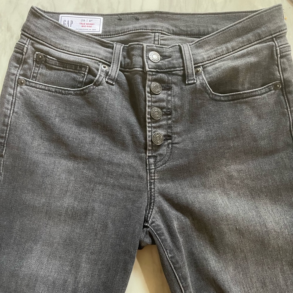 Women Gap button fly jeans. Gray distressed jeans.